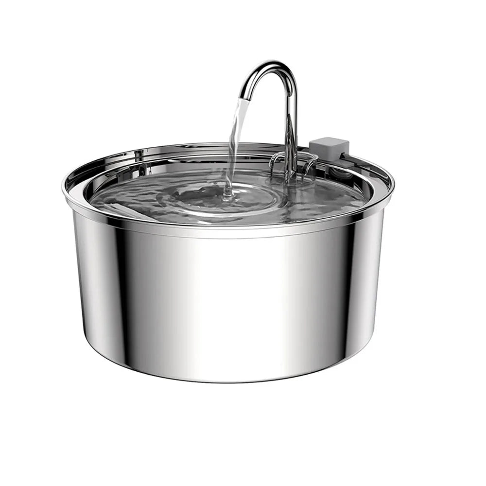Cylindrical stainless steel cat water fountain in 3/4 view, arched water stream in action