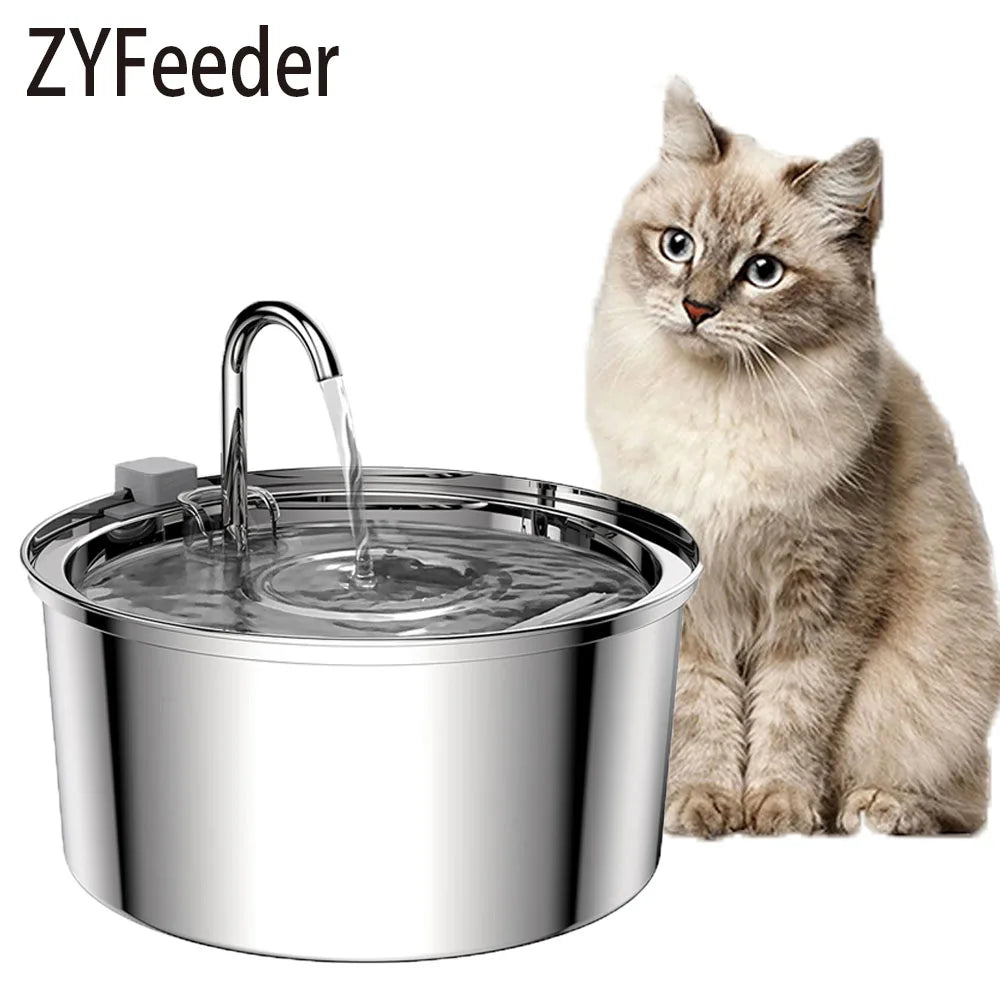 Beige longhair cat sitting next to the stainless steel cat water fountain with its arched stream